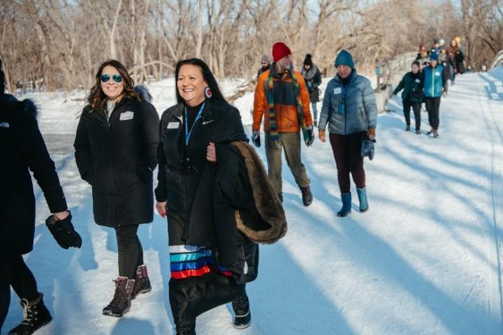 Participants walk across the snow at a Learning from Place: Bdote session at the Great Northern Festival in this undated photo. The Bdote program aims to help participants reevaluate their relationships with land and natural resources in light of Dakota traditions and stories. (Photo courtesy Jayme Halbritter / Great Northern Festival)