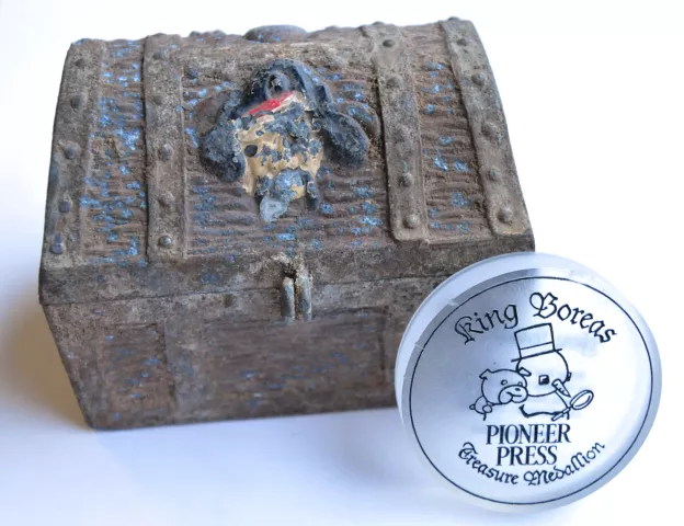 To mark the 60th anniversary of the Pioneer Press Treasure Hunt, this medallion, used in the past five hunts and photographed in St. Paul Jan. 11, 2012, was retired and given away. The treasure chest shown is the original from the first year of the Treasure Hunt, used to house the first medallion 60 years ago, in 1952. (Ginger Pinson / Pioneer Press)