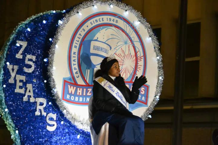 Royalty from Robbinsdale waves to paradegoers at the Vulcan Victory Torchlight Parade, part of St. Paul's Winter Carnival on Saturday, Feb. 3, 2024. The parade is held in hopes to bring summer back to the city of St. Paul. (Gabrielle Erenstein/Pioneer Press).
