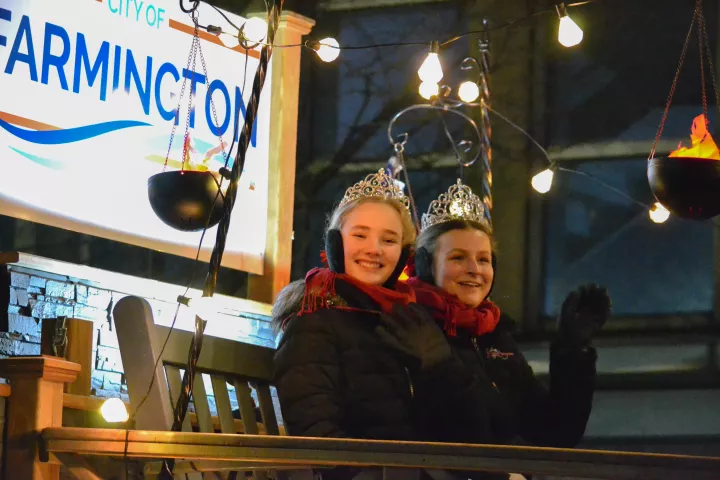 Royalty from Farmington wave at paradegoers during the Vulcan Victory Torchlight Parade in St. Paul on Saturday, Feb. 3, 2024. The parade is part of St. Paul's Winter Carnival. (Gabrielle Erenstein / Pioneer Press).