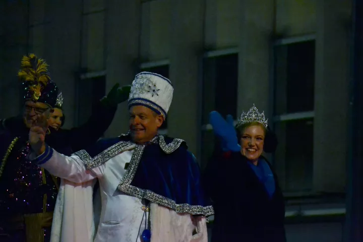 Vulcan Victory Torchlight Parade royalty wave to the paradegoers on Fifth Street in downtown St. Paul on Saturday, Feb. 3, 2024. The parade is part of the St. Paul Winter Carnival. (Gabrielle Erenstein / Pioneer Press).