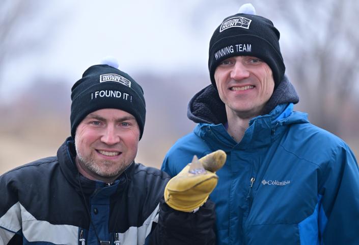Brothers, Luke and Josh Koopmeiners, hold the crystal pyramid that was the 2024 Pioneer Press Treasure Hunt medallion in Bruce Vento Nature Sanctuary on Saturday, Jan. 27, 2024. (John Autey / Pioneer Press)