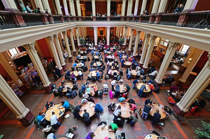 Spectators on the second floor watch dozens of teams put together jig saw puzzles at the 2023 Winter Carnival Jigsaw Puzzle Contest at Landmark Center in St. Paul on Saturday, Jan. 28, 2023. (John Autey / Pioneer Press)