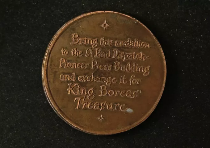 The back face of one of the original bronze medallions used for the St. Paul Pioneer Press Treasure Hunt in St. Paul on Thursday, Jan. 18, 2024. (John Autey / Pioneer Press)