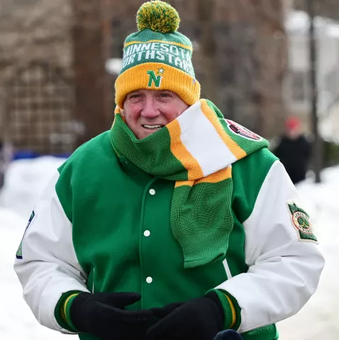 Sports Grand Marshall Tom Reid stays warm before the start of the 2023 Winter Carnival Grande Day Parade in downtown St. Paul on Saturday, Jan. 28, 2023. (John Autey / Pioneer Press)