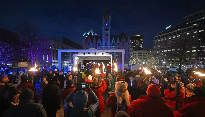 Torch bearers make an appearance at Rice Park in St. Paul on Thursday, Jan. 26, 2023. The Royal Family and the Vulcans joined with community members to officially start the 2023 St. Paul Winter Carnival. (John Autey / Pioneer Press)