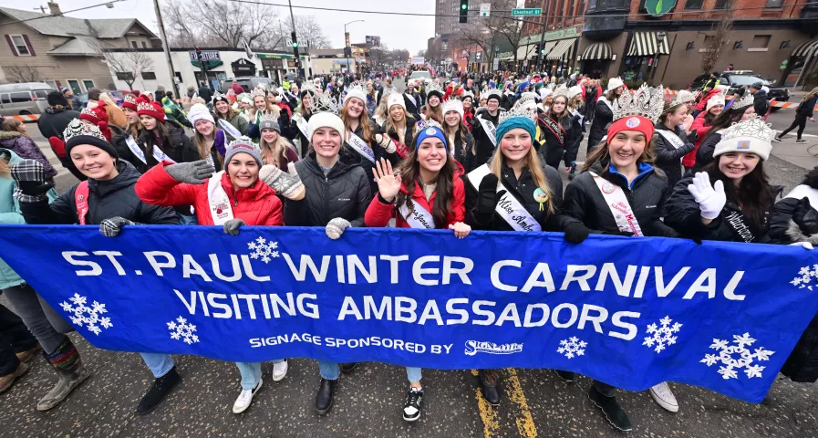 Dozens of visiting princesses march during the 2024 St. Paul Winter Carnival King Boreas Grande Day Parade along West 7th Street in downtown on Saturday, Jan. 27, 2024. (John Autey / Pioneer Press)