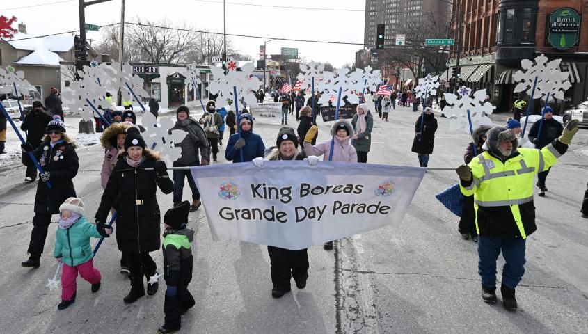 Marchers proudly carry the King Boreas Grande Day Parade banner heralding the start of the 2023 Winter Carnival Grande Day Parade in downtown St. Paul on Saturday, Jan. 28, 2023. (John Autey / Pioneer Press)