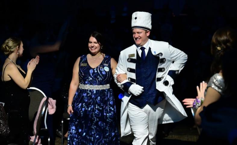 Dave Schmidt, 2023 Titan, Prince of the North Wind walks to the stage with his wife Laura Schmidt during the 2023 Winter Carnival Royal Coronation at St. Paul RiverCentre on Friday, Jan. 27, 2023. (John Autey / Pioneer Press)