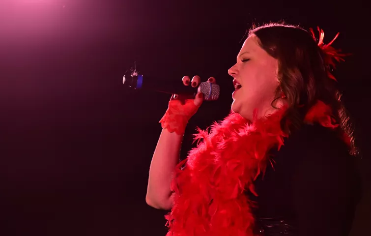 Jody Vander Hart, from Vadnais Heights, sings during the Klondike Kate contest at the DoubleTree by Hilton Saint Paul East on Wednesday, Jan. 11, 2023. (John Autey / Pioneer Press)