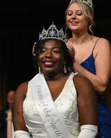 Rahila Hungiapuko is crowned North Wind Princess by 2022 North Wind Princess Kylie Johnson during the 2023 Winter Carnival Royal Coronation at St. Paul RiverCentre on Friday, Jan. 27, 2023. (John Autey / Pioneer Press)