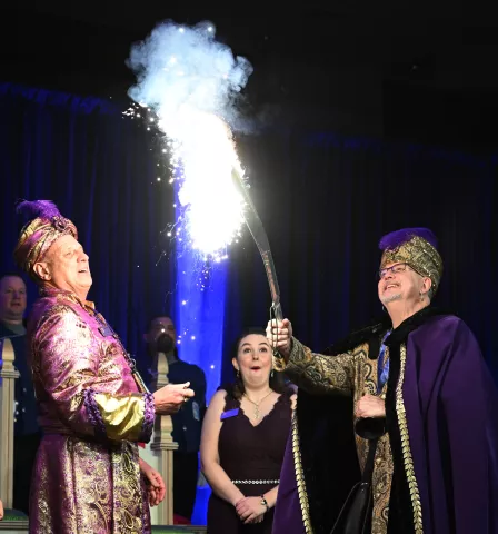 Lew Vogel, right, 2023 Euros, Prince of the East Wind lights up as he is introduced during the 2023 Winter Carnival Royal Coronation at St. Paul RiverCentre on Friday, Jan. 27, 2023. (John Autey / Pioneer Press) Buy images from this gallery