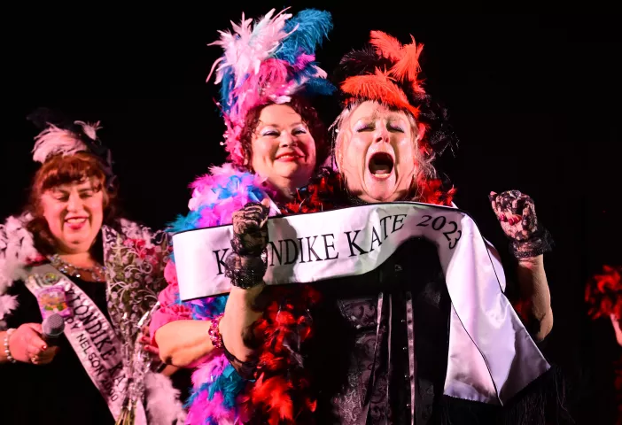 Maret Bylander, 2023 Klondike Kate, is sashed by 2022 Klondike Kate Tina Hacker at the end of the Klondike Kate contest at the DoubleTree by Hilton Saint Paul East on Wednesday, Jan. 11, 2023. (John Autey / Pioneer Press)