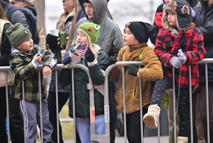 (from left) Henry Beece, 13, his sister Harper, 9, brother Harrisen, back, cousin Stella Beece, 9, and sister Ruby, 7, watch 2024 St. Paul Winter Carnival King Boreas Grande Day Parade along Washington Street in downtown on Saturday, Jan. 27, 2024. (John Autey / Pioneer Press)