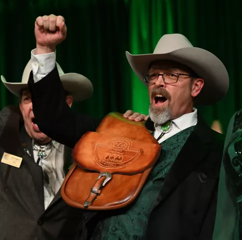 Mike Cummings lets loose a cowboy whoop after being introduced as the 2023 Zephyrus, Prince of the West Wind during the 2023 Winter Carnival Royal Coronation at St. Paul RiverCentre on Friday, Jan. 27, 2023. (John Autey / Pioneer Press)
