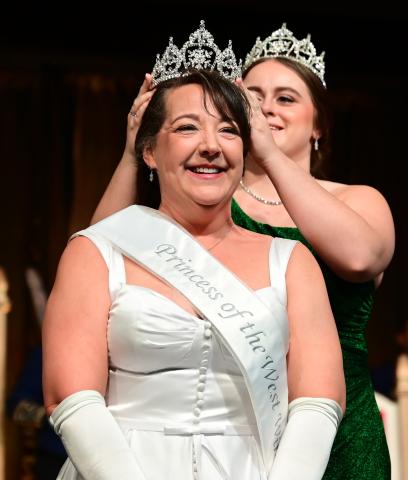 Dee Barrett, the 2023 West Wind Princess, is crowned by the 2022 West Wind Princess Shannon Baier during the 2023 Winter Carnival Royal Coronation at St. Paul RiverCentre on Friday, Jan. 27, 2023. (John Autey / Pioneer Press)