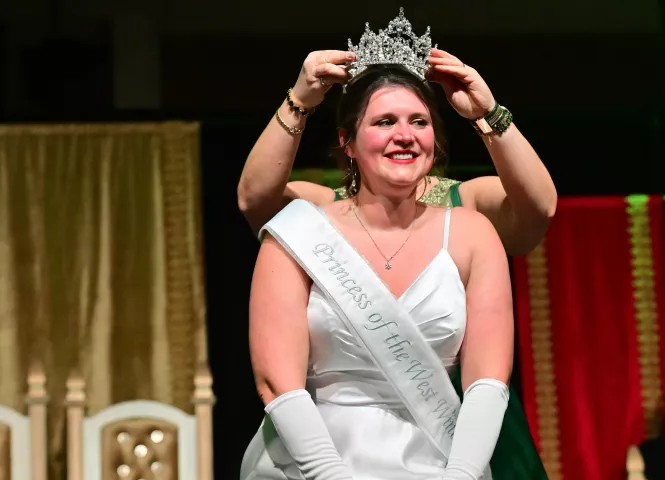 Amy Lyn Johnson is crowned the 2024 West Wind Princess, by the outgoing West Wind Princess Dee Barrett during the 2024 St. Paul Winter Carnival Royal Coronation at the RiverCentre in St. Paul on Friday, Jan. 26, 2024. (John Autey / Pioneer Press)