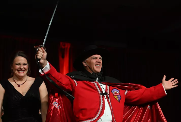 Dennis Boe, the 2023 Notos, Prince of the South Wind lets out an "Ole!" in front of his wife Lisa after being introduced during the 2023 Winter Carnival Royal Coronation at St. Paul RiverCentre on Friday, Jan. 27, 2023. (John Autey / Pioneer Press)