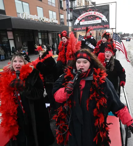 Past Klondike Kates join current Kate Maret Bylander in performing at the 2023 Winter Carnival Grande Day Parade in downtown St. Paul on Saturday, Jan. 28, 2023. (John Autey / Pioneer Press)