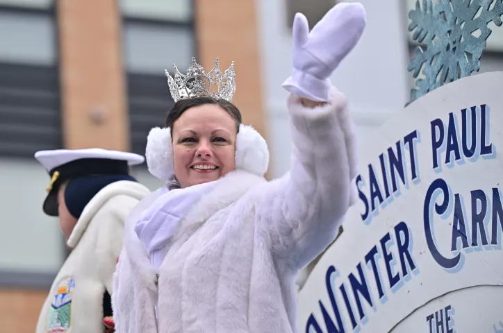 Jennifer Westerhaus, 2024 Aurora, Queen of the Snows, waves to the crowds during the 2024 St. Paul Winter Carnival Grande Day Parade along West 7th Street in downtown on Saturday, Jan. 27, 2024. (John Autey / Pioneer Press)