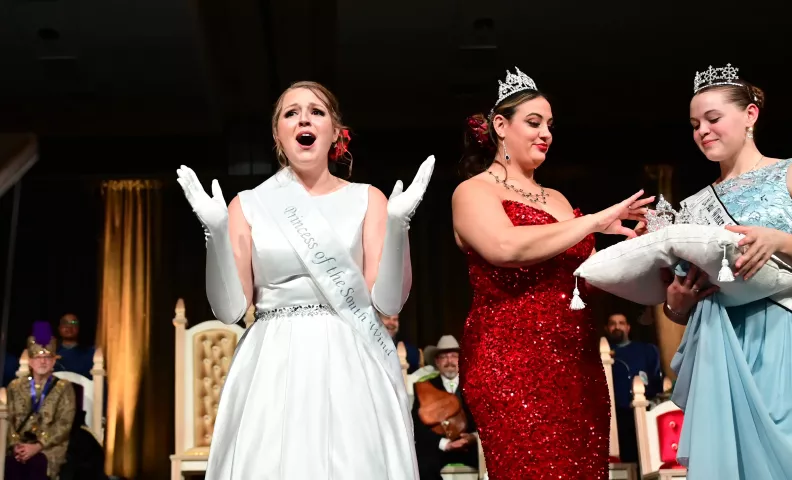 Jocelyn O’Neill, left, reacts after being named Princess of the South Wind during the 2023 Winter Carnival Royal Coronation at St. Paul RiverCentre on Friday, Jan. 27, 2023. (John Autey / Pioneer Press)