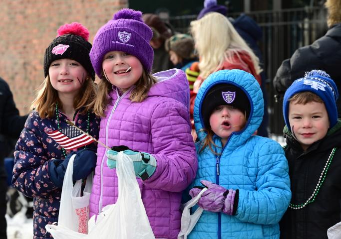 The cold didn’t stop (from left) Cousins Bridgid Baker, 7, sisters Marienne, 7, and Morgan Osborne, 4, and Wesley Carroll, 5, from having fun at the 2023 Winter Carnival Grande Day Parade in downtown St. Paul on Saturday, Jan. 28, 2023. (John Autey / Pioneer Press)