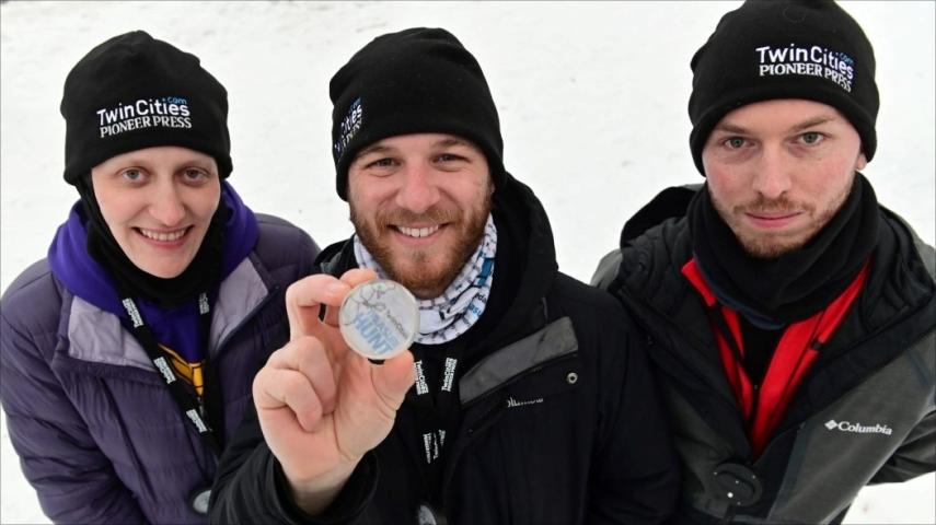 St. Paul Pioneer Press Treasure Hunt Medallion finders (from left) Julie Schonhardt, Josh Ellingson and Zak Rexford pose with their find at West Park in White Bear Lake on Sunday, Jan. 31, 2021. It was the second year that their team found the medallion. (John Autey / Pioneer Press)