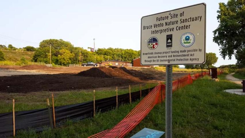 A sign seen Aug. 26, 2015, marks the site of a future interpretive center at Bruce Vento Nature Sanctuary in St. Paul. An abandoned building was torn down in 2015 to make way for the center. (Pioneer Press: Andy Rathbun)